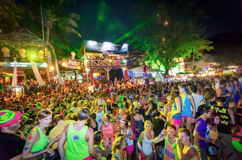 Tourists enjoying the Full Moon Party on the beach in Thailand